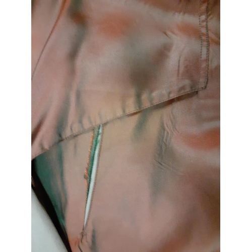 74 - A 1980's Aquascutum Aqua 5 grey/green raincoat having 2 deep internal pockets, 44