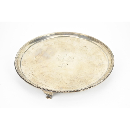 132 - A George III silver salver by Richard Rugg II, London 1783, of circular form with beaded rim, the ce... 