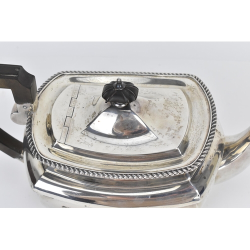 135 - An Edwardian silver teapot by Elkington & Co Ltd, Birmingham 1904, with gadrooned border, turned ebo... 