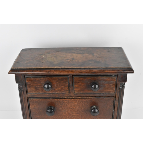 183 - A William IV mahogany miniature/apprentice chest of drawers, circa 1830, with moulded top above two ... 