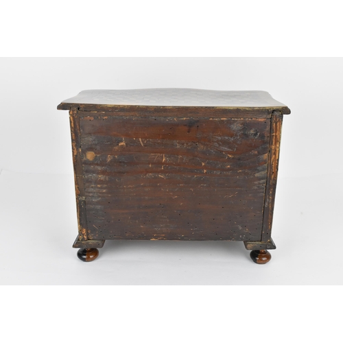 184 - An 18th century Louis XV period miniature/apprentice commode, of serpentine form with moulded border... 