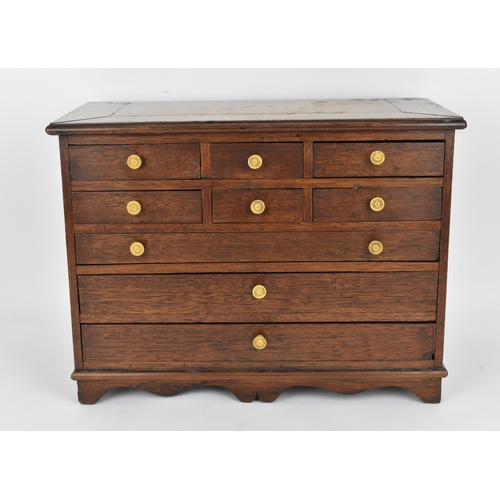 185 - A Regency period mahogany apprentice chest of drawers, with moulded top above two sets of three shor... 