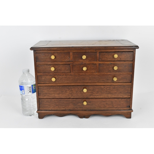 185 - A Regency period mahogany apprentice chest of drawers, with moulded top above two sets of three shor... 