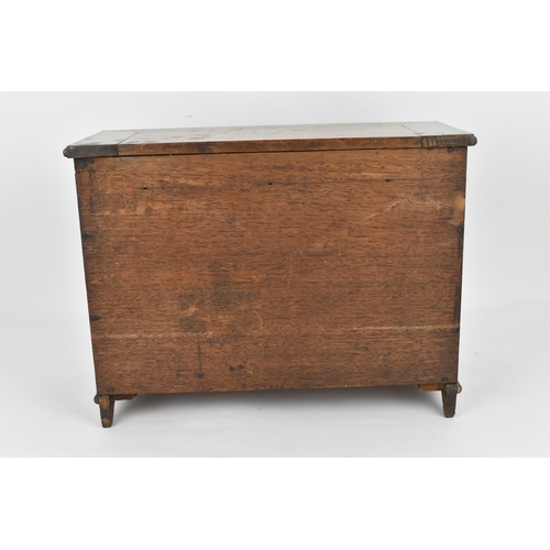 185 - A Regency period mahogany apprentice chest of drawers, with moulded top above two sets of three shor... 