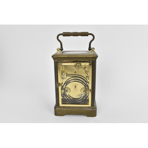 58 - An early/mid 20th century brass cased carriage clock, white enamel dial signed 'Rapport Fondee en 19... 