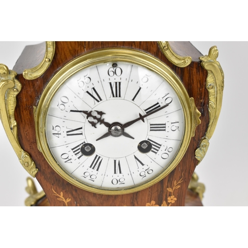 61 - A late 19th century French rosewood marquetry inlaid mantle clock having applied gilt metal floral m... 