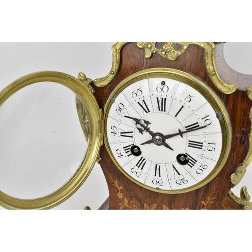 61 - A late 19th century French rosewood marquetry inlaid mantle clock having applied gilt metal floral m... 