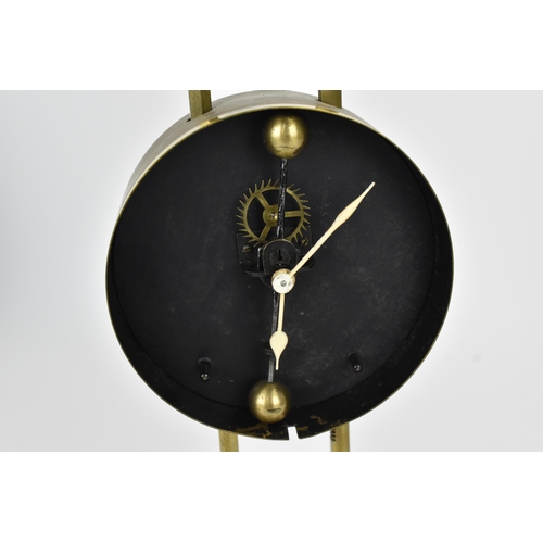 63 - A late 19th/early 20th century brass cased gravity clock having a visual escapement, the Arabic nume... 