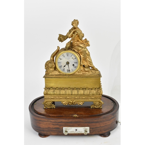 65 - A 19th century French rare musical figural mantle clock, the gilt metal case in the form a female ho... 