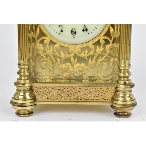 82 - A late 19th/early 20th century gilt metal French miniature carriage clock having turned finials, ree... 