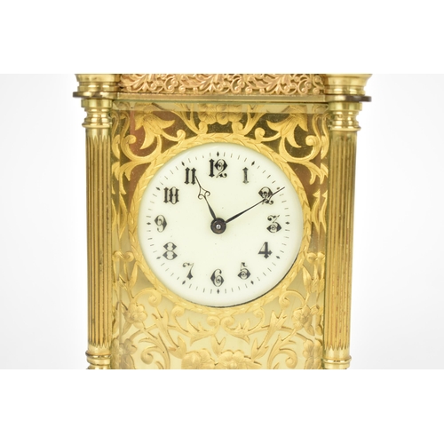 82 - A late 19th/early 20th century gilt metal French miniature carriage clock having turned finials, ree... 