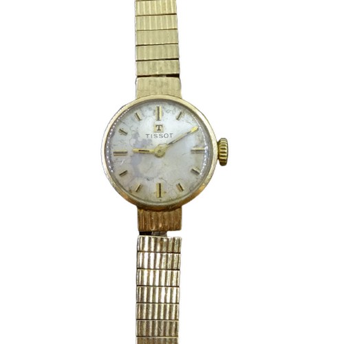 95 - A Tissot manual wind, ladies 9ct gold wristwatch, the dial having baton markers and signed Tissot, 9... 