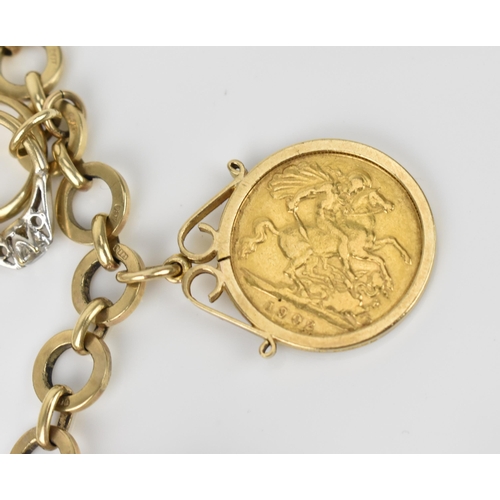 115 - A 9ct yellow gold charm bracelet, with various hanging charms, to include a carousel, bird's cage, t... 