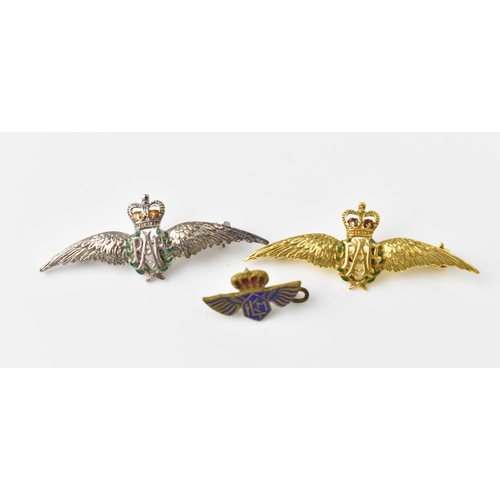 117 - Two enamelled RAF brooches, one silver and one 9ct yellow gold, with green enamelled wreath, surmoun... 