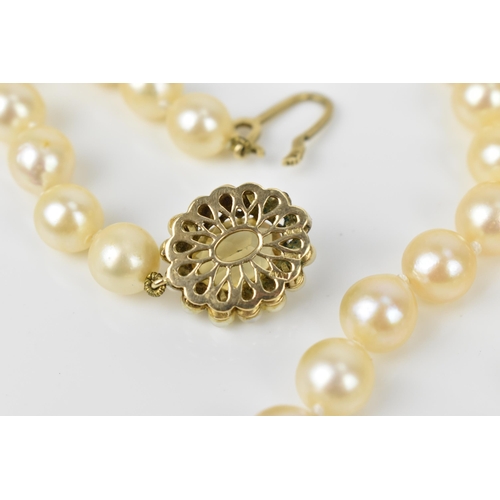 119 - A single strand of cultured white pearls, with 9ct yellow gold, seed pearl and oval cut citrine clas... 