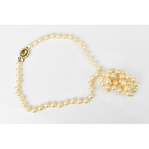 119 - A single strand of cultured white pearls, with 9ct yellow gold, seed pearl and oval cut citrine clas... 