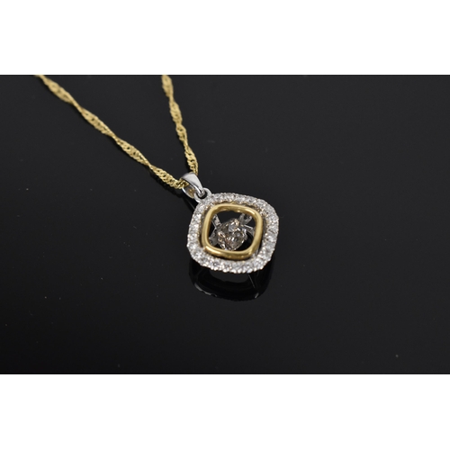 156 - A two tone 14ct gold and diamond pendant, on an Italian 14ct yellow gold Singapore chain, the pendan... 