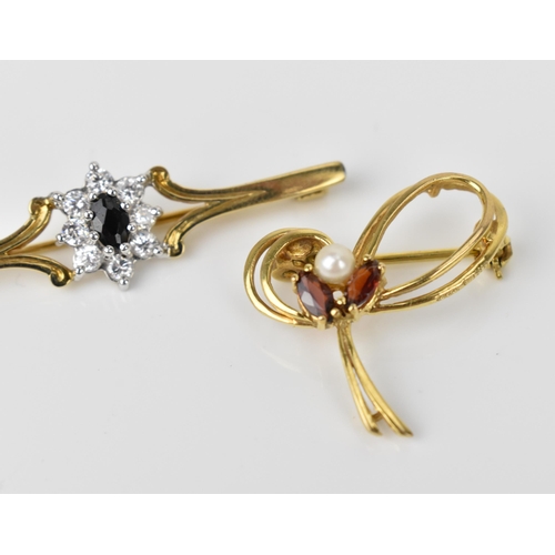 160 - A 9ct yellow gold, cubic zirconia and dark stone floral brooch, together with a 9ct yellow gold, pea... 