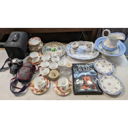 183 - A mixed lot to include a Canon EOS 500 and accessories, Yoga for Men book and mixed china to include... 