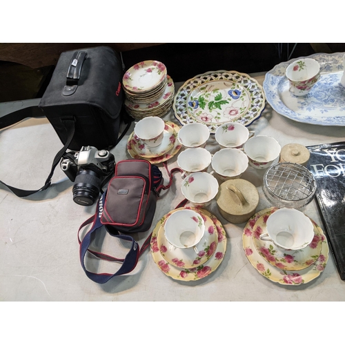 183 - A mixed lot to include a Canon EOS 500 and accessories, Yoga for Men book and mixed china to include... 