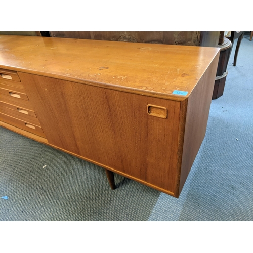 189 - A mid 20th century Clausen & Son teak sideboard having two sliding doors and four drawers, 71cm h x ... 