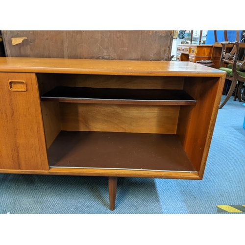 189 - A mid 20th century Clausen & Son teak sideboard having two sliding doors and four drawers, 71cm h x ... 