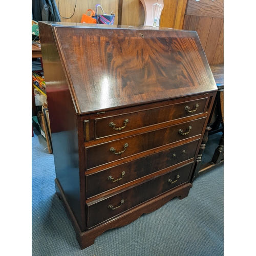 195 - A reproduction mahogany bureau having a fall flap above four drawers, 99cm h x 76cm w
Location:A2B