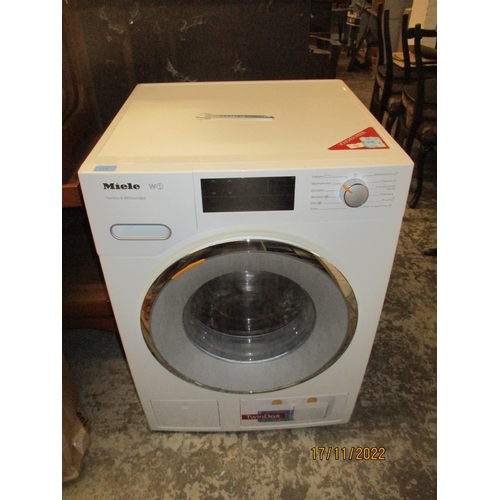 212 - A Miele W1 Twin DOS and WiFi connect washing machine with spanner to release the drum
Location:G