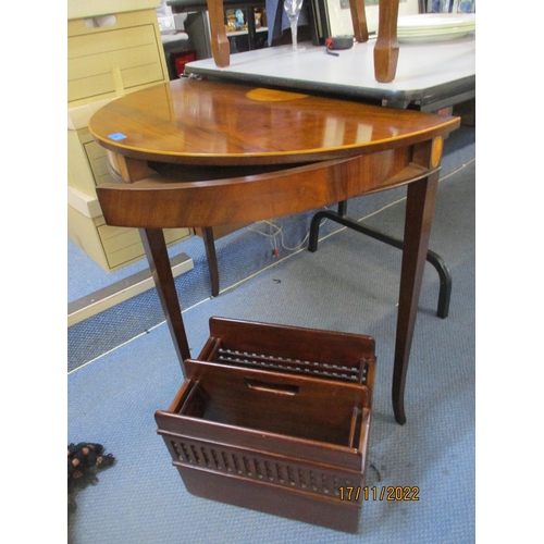 214 - A reproduction inlaid mahogany demi lune side table on square tapering legs and splayed feet with pu... 