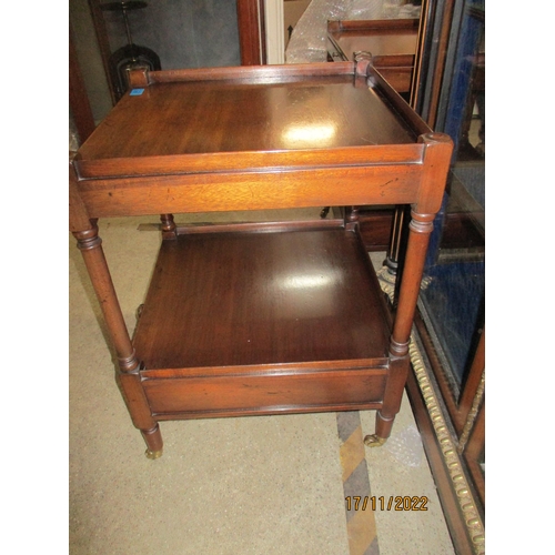 215 - A pair of reproduction mahogany bedside tables, the galleried top with brushing slide over an undert... 