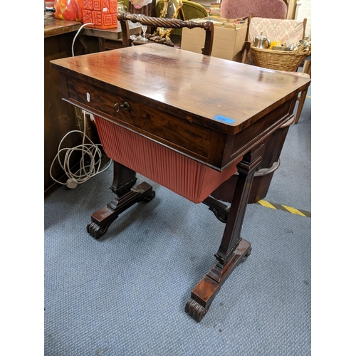 220 - A Victorian mahogany work table having a single drawer with storage below and on scroll shaped feet,... 