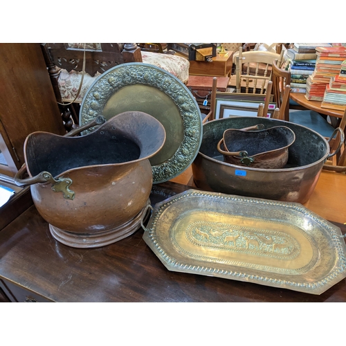 222 - Two Victorian copper coal buckets together with a twin handled basket and two brass trays
Location:A... 