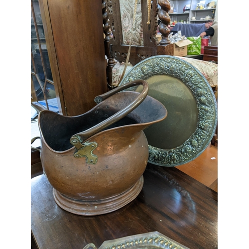 222 - Two Victorian copper coal buckets together with a twin handled basket and two brass trays
Location:A... 