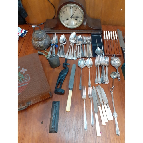 223 - Silver plated and other cutlery and flatware, a mid 20th century oak cased mantel clock, two brass b... 