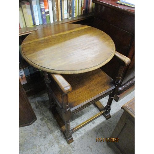 232 - An early 20th century carved oak chair/table combination, the back revolving for use as a table top ... 