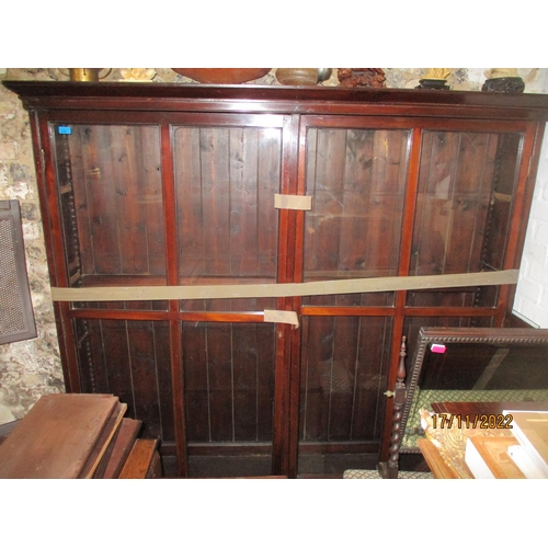 235 - An 18th century and later mahogany bookcase, twin glazed doors and adjustable interior shelves, on o... 