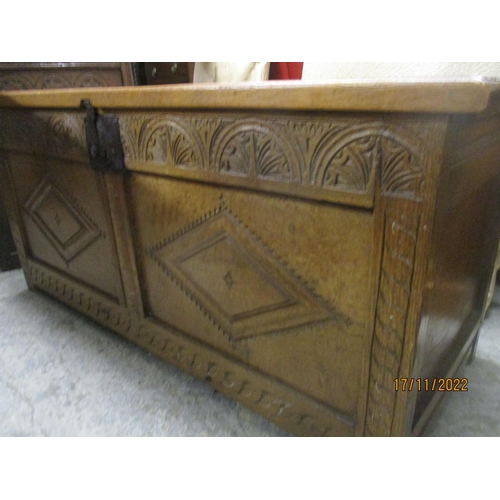 237 - An 18th century oak coffer, the carved panelled front with diamond motif decoration, iron lock plate... 