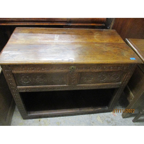 238 - An 18th century oak coffer with panelled and carved front and sides, open storage space to base 77cm... 