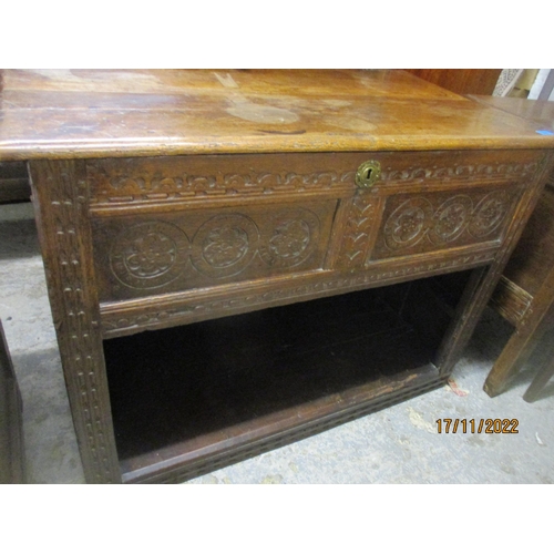 238 - An 18th century oak coffer with panelled and carved front and sides, open storage space to base 77cm... 