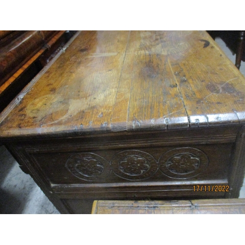 238 - An 18th century oak coffer with panelled and carved front and sides, open storage space to base 77cm... 