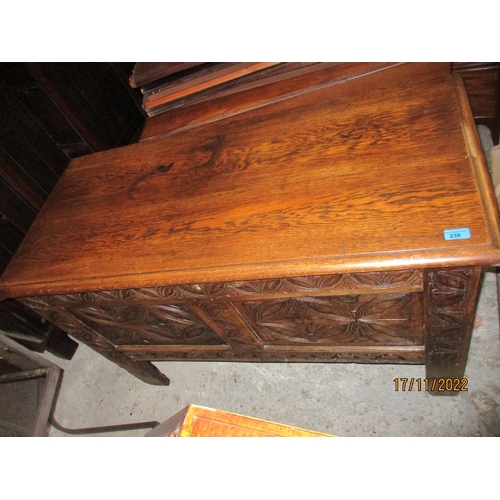 239 - An 18th century oak coffer with carved panelled front, panelled sides and back, on stile feet 76cm x... 