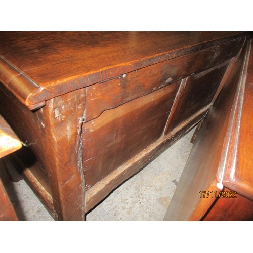 239 - An 18th century oak coffer with carved panelled front, panelled sides and back, on stile feet 76cm x... 