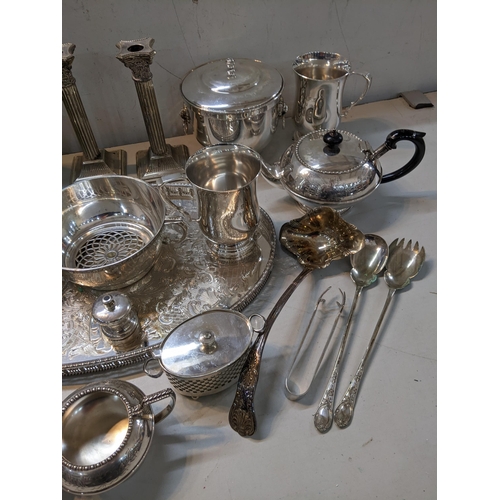 27 - Silver plate to include a pair of candlesticks, a bowl, an ice bucket, tankards, a tray and other it... 