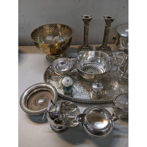 27 - Silver plate to include a pair of candlesticks, a bowl, an ice bucket, tankards, a tray and other it... 