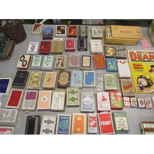 43 - A mixed lot to include playing cards, bone dominoes, toy figures such as cowboys, soldiers, pirates ... 