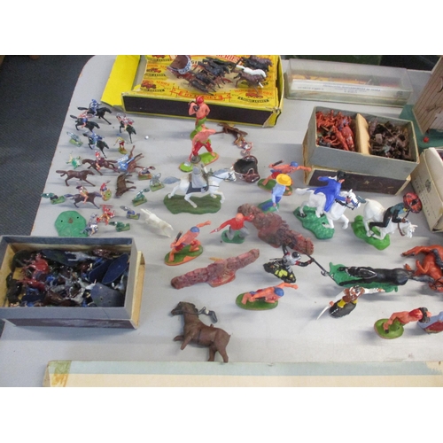 43 - A mixed lot to include playing cards, bone dominoes, toy figures such as cowboys, soldiers, pirates ... 