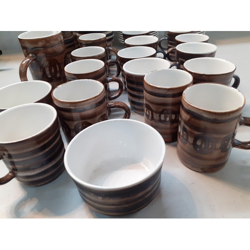 52 - A Rye pottery coffee and tea set comprising two pots, two jugs, nine tea cups, six coffee cups, two ... 