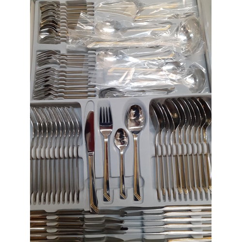 58 - An SBS Bestecke Solingen 12-setting cutlery set in a gold and silver colour housed in a silver metal... 