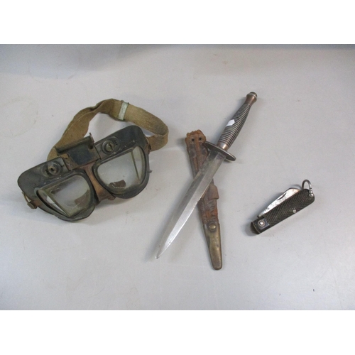 61 - Air Ministry goggles together with a commando style dagger and a pen knife
Location:A1M