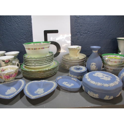 64 - A mixed lot to include Wedgwood blue jasperware, Royal Albert Serana tea cups, character jugs and ot... 